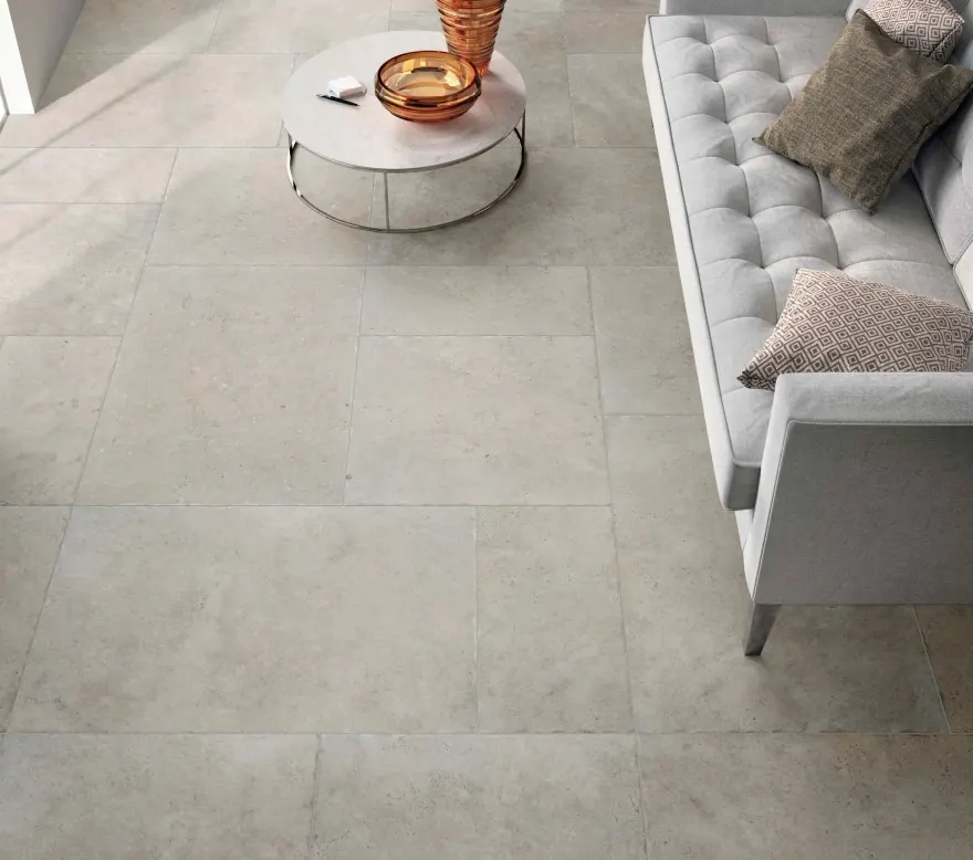 Large-format stone floor in a styled living room