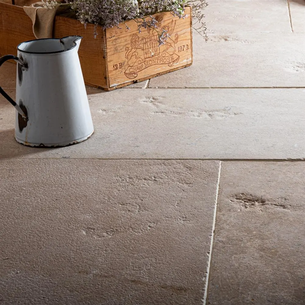 Weathered French limestone flags with a jug and crate