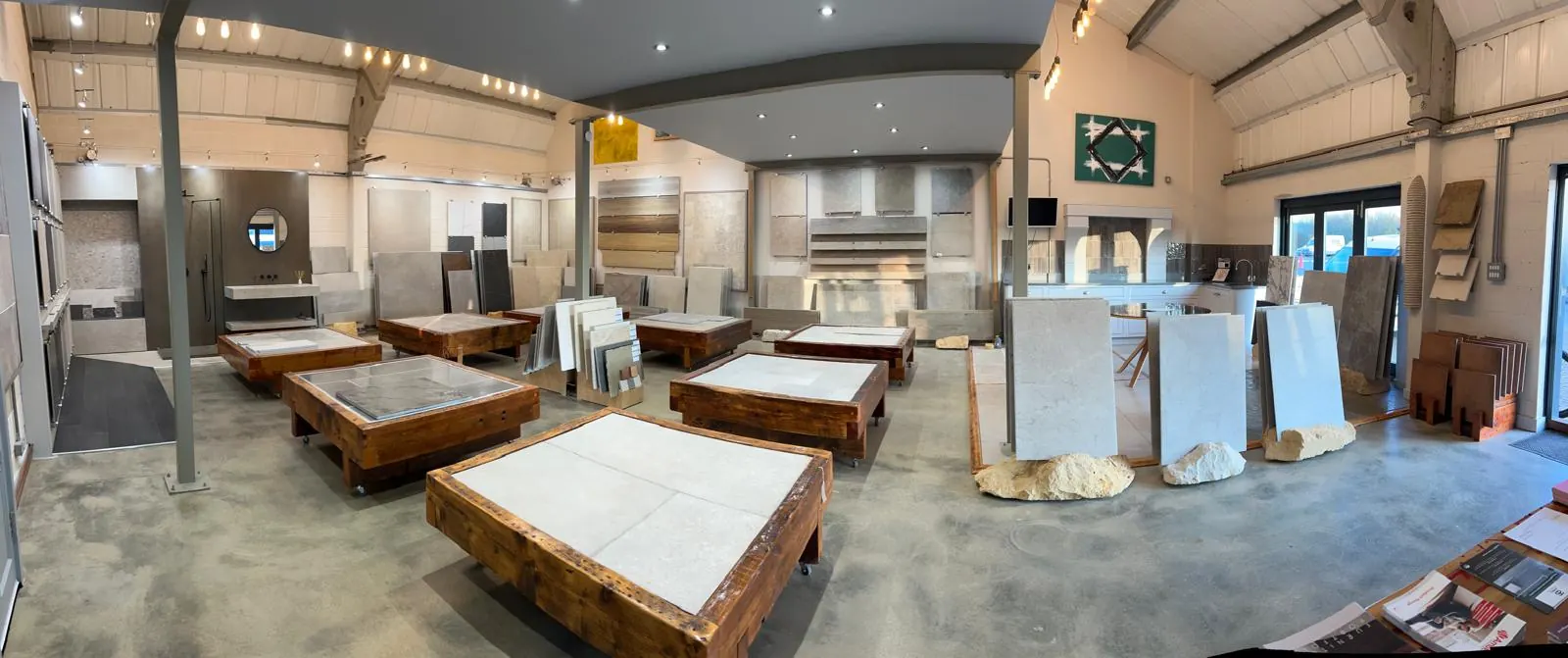 Inside the showroom, slabs displayed on trestles